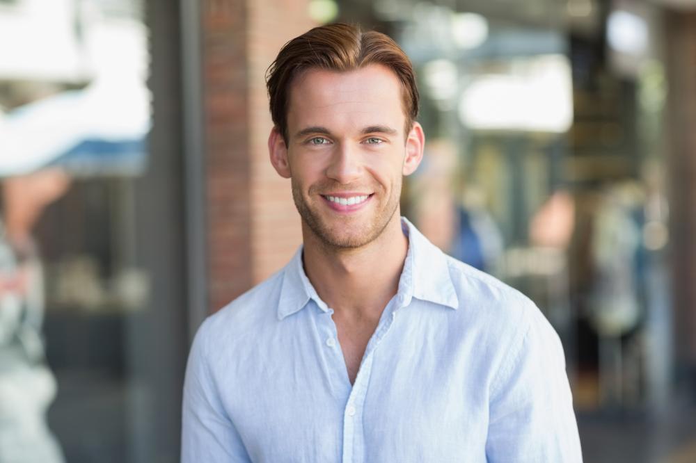 happy man using essential oils