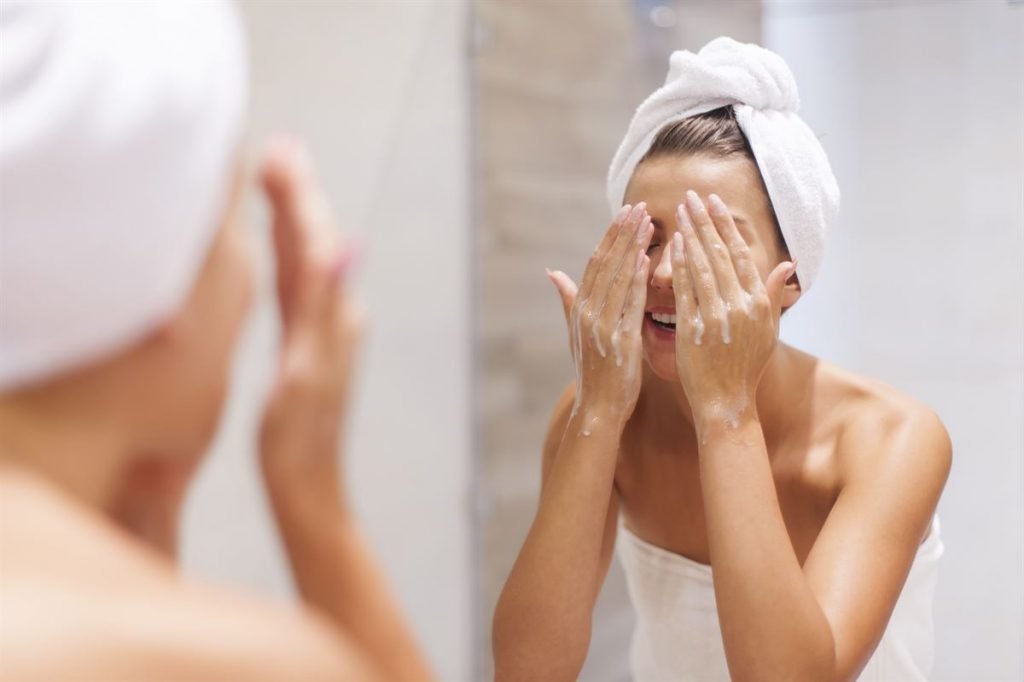 woman washing face