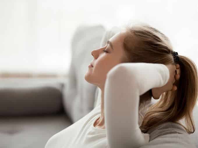 woman relaxing with aromatherapy