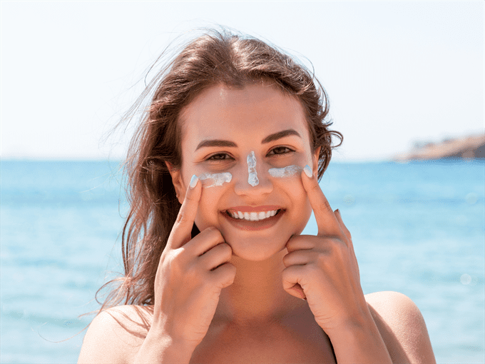woman with sunscreen on face