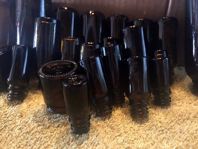 recycled essential oil bottles drying