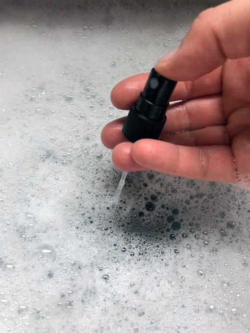 spray soapy water through nozzle