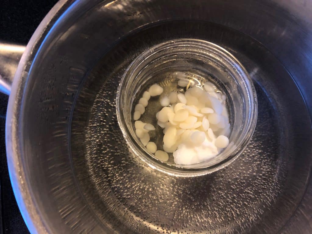 melting coconut oil in hot water